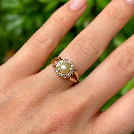 Vintage, 1980s pearl & diamond cluster ring worn on hand.