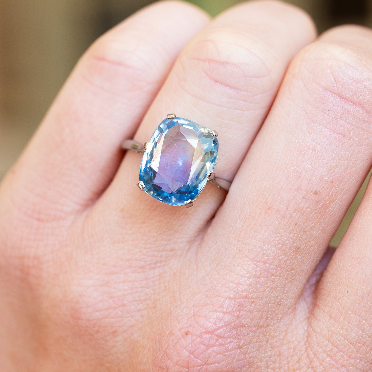 Close up of a 1920s blue sapphire solitaire ring.
