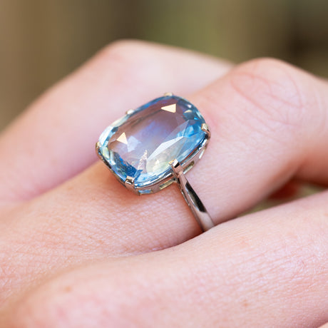 1920s sapphire solitaire ring showing light blue gemstone and minimal setting detail.
