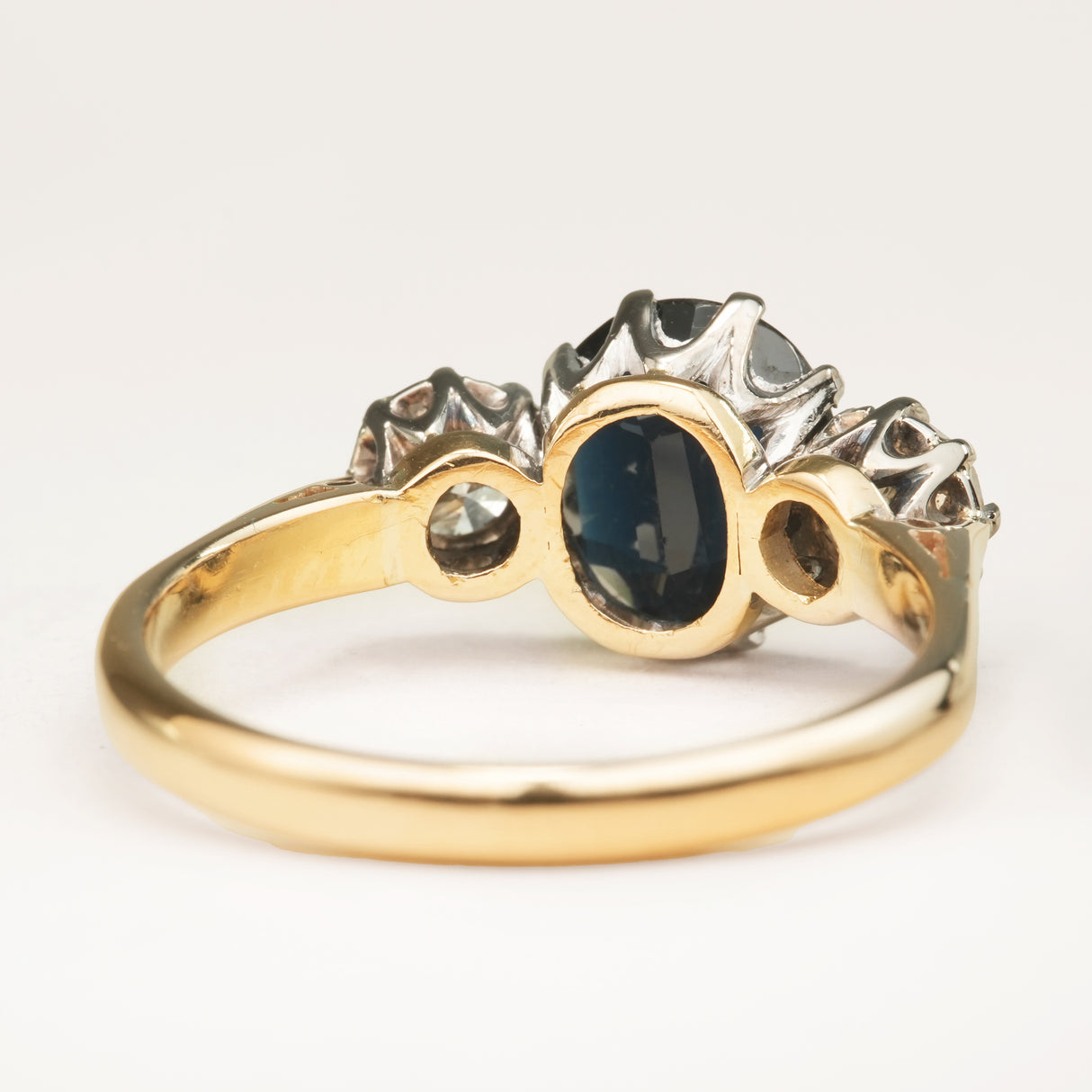 Vintage, 1950s dark blue sapphire and diamond three-stone engagement ring