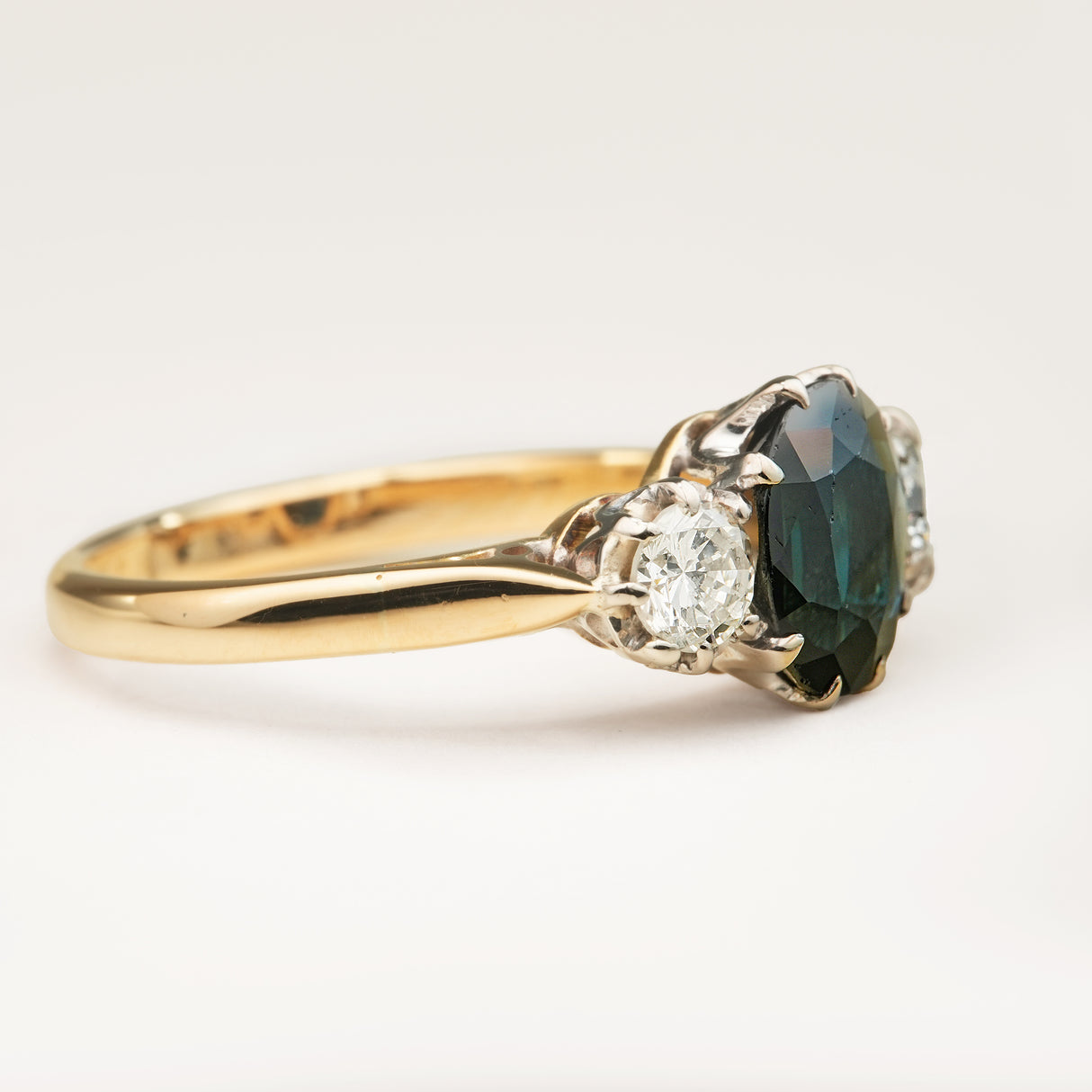 Vintage, 1950s dark blue sapphire and diamond three-stone engagement ring