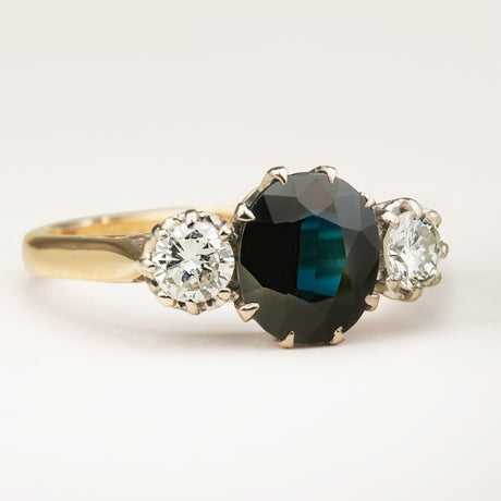 Vintage, 1950s dark blue sapphire and diamond three-stone engagement ring
