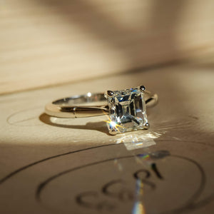1980s solitaire diamond engagement ring with square cut diamond