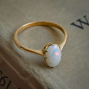 1990s precious opal solitaire ring with yellow gold band