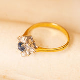 Vintage 1990s sapphire cluster ring with a vivid blue sapphire and diamond surround set in yellow and white gold.
