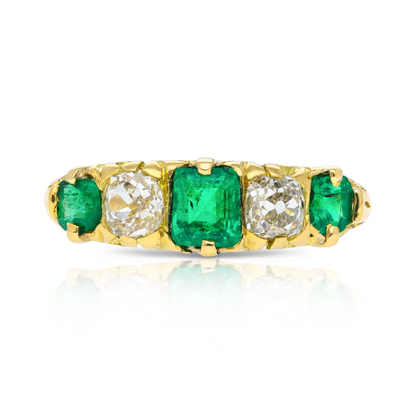 Five stone emerald and diamond ring, front view.