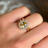 Yellow sapphire and diamond 18ct yellow gold cluster ring worn stacked with a wedding band showing proportions. 