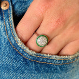 Vintage, Art Deco emerald & diamond target cluster ring worn on hand. 