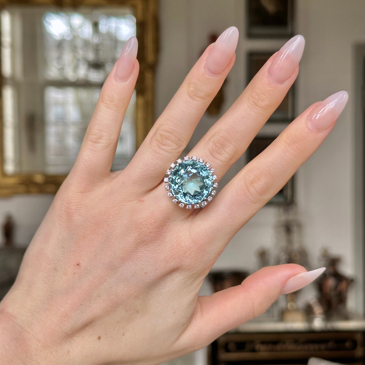 20ct Aquamarine and Diamond Cluster Ring, 18ct White Gold, Circa 1970 worn on hand.