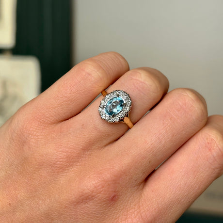 Antique, Edwardian blue topaz & diamond cluster ring worn on hand
