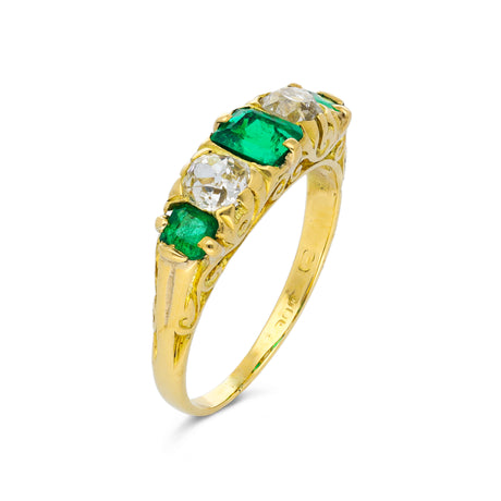 Five stone emerald and diamond ring, side view.