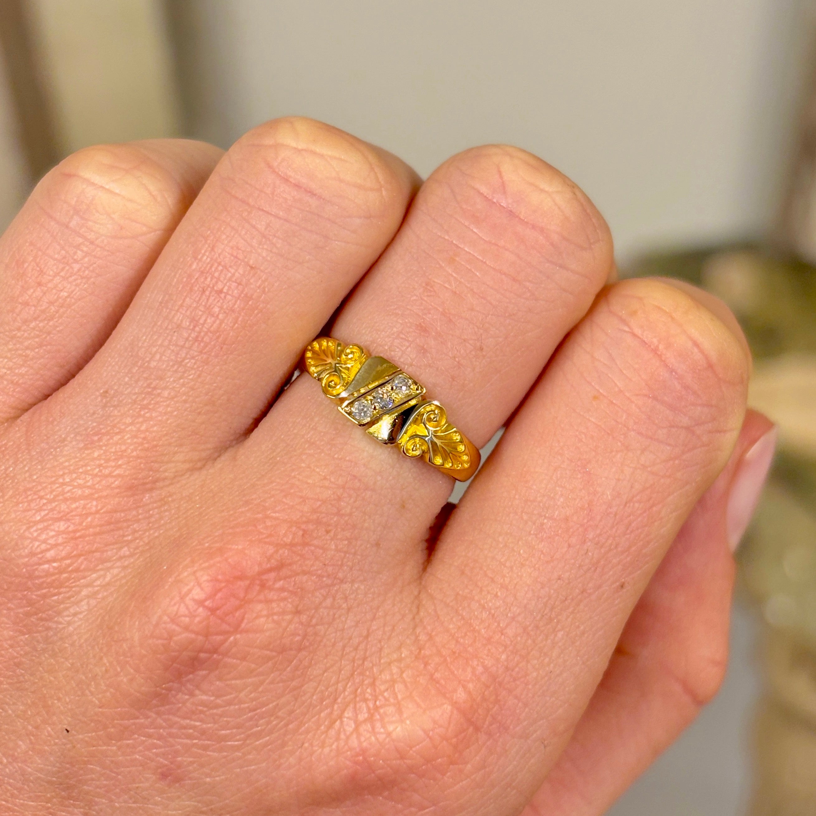 Antique, Victorian three-stone diamond scroll ring