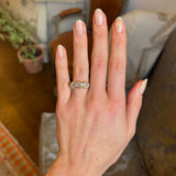 Antique, Victorian three-stone diamond ring worn on hand