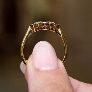Gallery view highlighting the setting of an antique Edwardian ruby and diamond five-stone engagement ring.