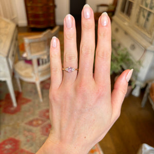 Padparascha sapphire and diamond three-stone engagement ring