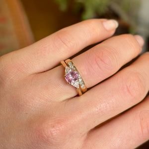 Padparascha sapphire and diamond three-stone engagement ring