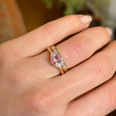 Padparascha sapphire and diamond three-stone engagement ring