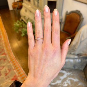 Blush-pink and apricot-orange sapphire three-Stone engagement ring