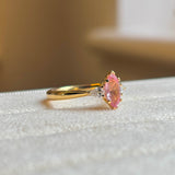 Pink sapphire and diamond three-stone engagement ring