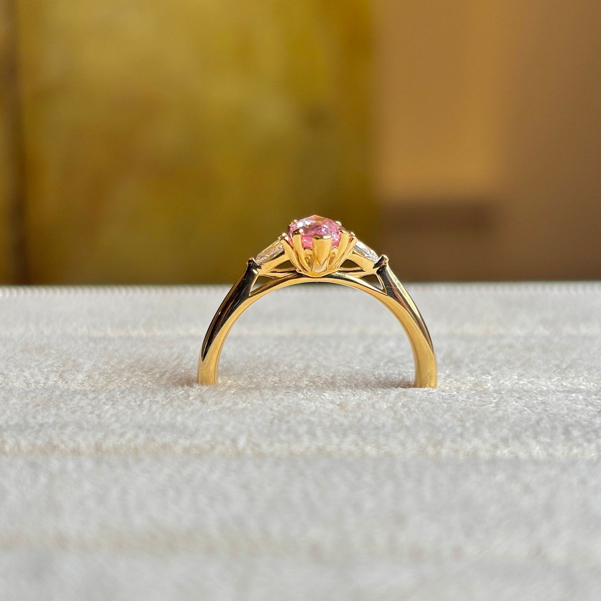 Marquise-cut Padparascha Pink sapphire and diamond three-stone engagement ring