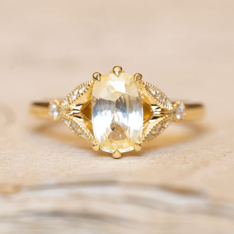 Antique-inspired yellow cushion cut sapphire & diamond engagement ring in 14ct yellow gold. 