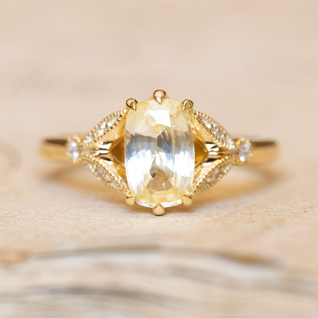 Antique-inspired yellow cushion cut sapphire & diamond engagement ring in 14ct yellow gold. 