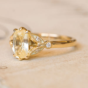 Vintage-inspired yellow cushion cut sapphire & diamond engagement ring in 14ct yellow gold. 