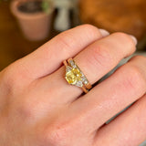 Yellow sapphire and diamond three-stone ring