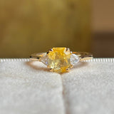 Yellow sapphire and diamond three-stone ring