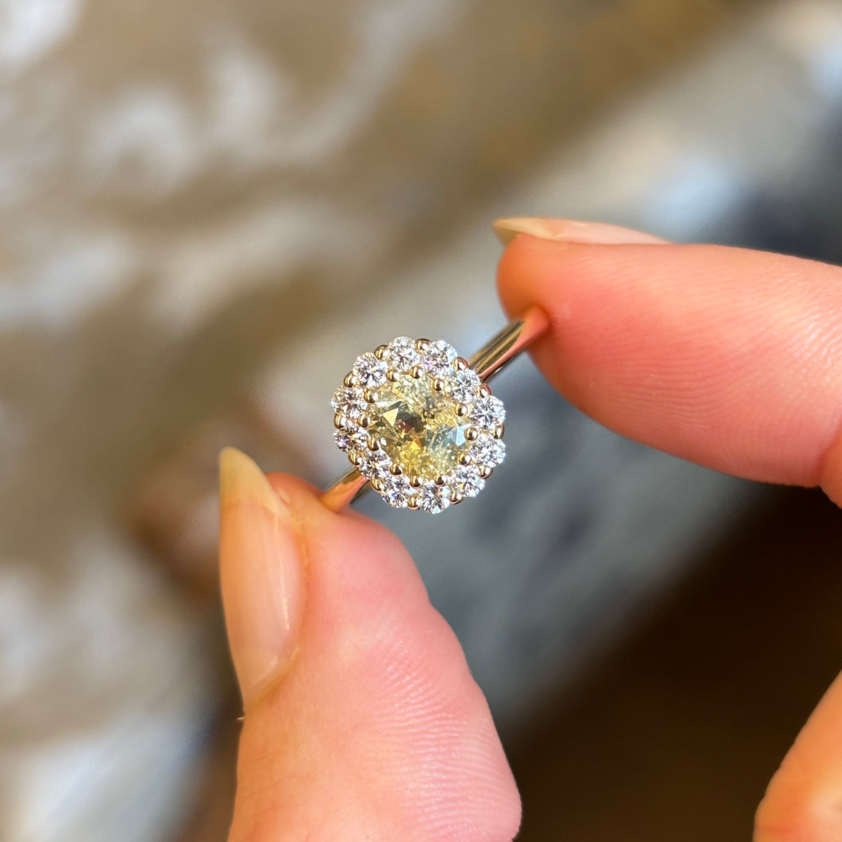 Yellow sapphire and diamond cluster engagement ring