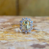 Yellow sapphire and diamond cluster engagement ring