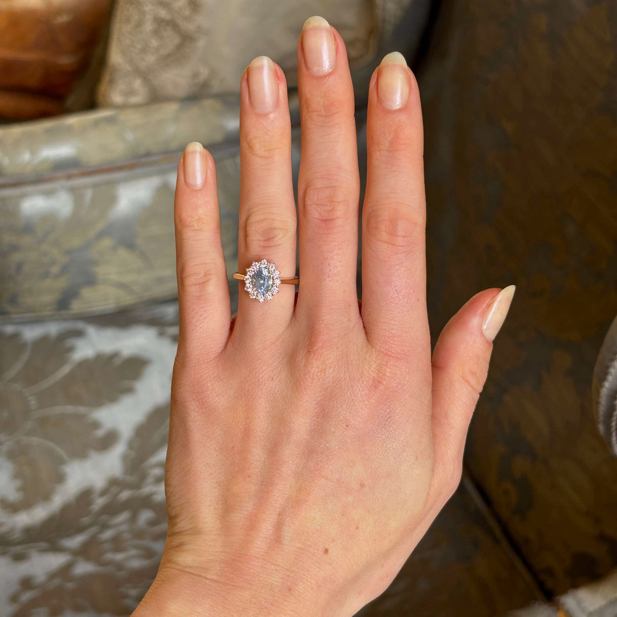 Blue sapphire and diamond cluster engagement ring