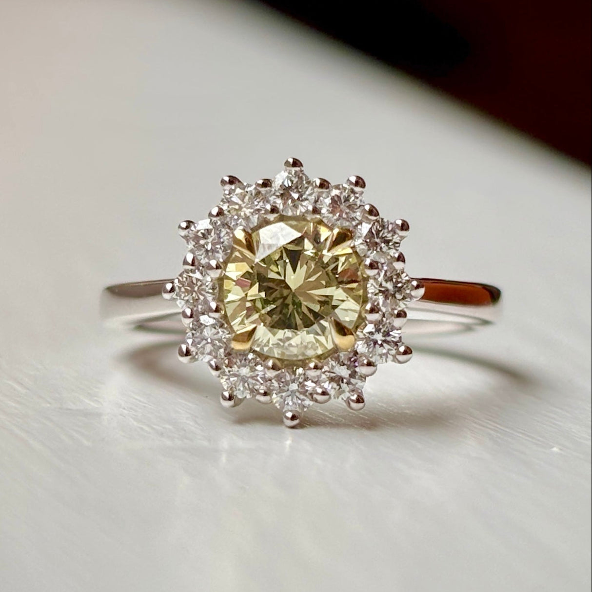 Tinted yellow 1.01ct diamond cluster engagement ring