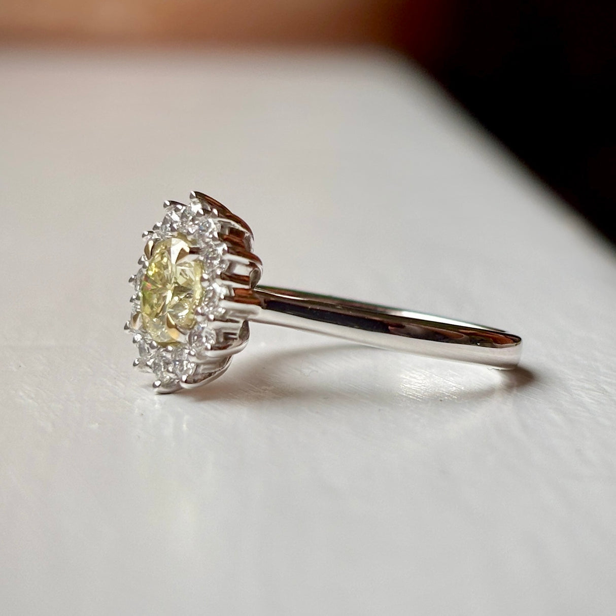 Tinted yellow 1.01ct diamond cluster engagement ring