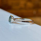 Pear-cut teal sapphire & diamond three-stone engagement ring