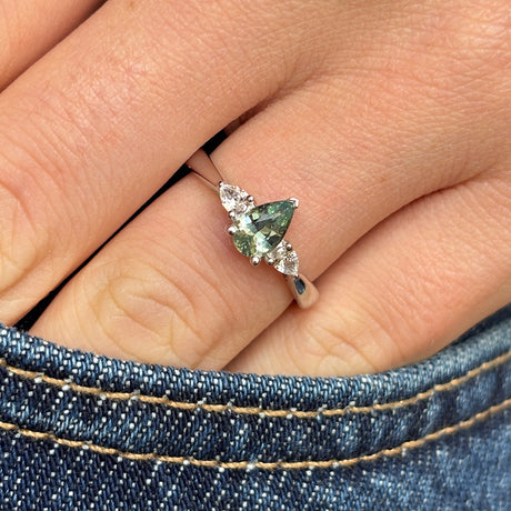  Pear-cut teal sapphire & diamond three-stone engagement ring