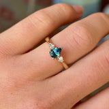 Pear-cut teal sapphire & diamond three-stone ring