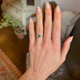 Green sapphire and diamond cluster engagement ring