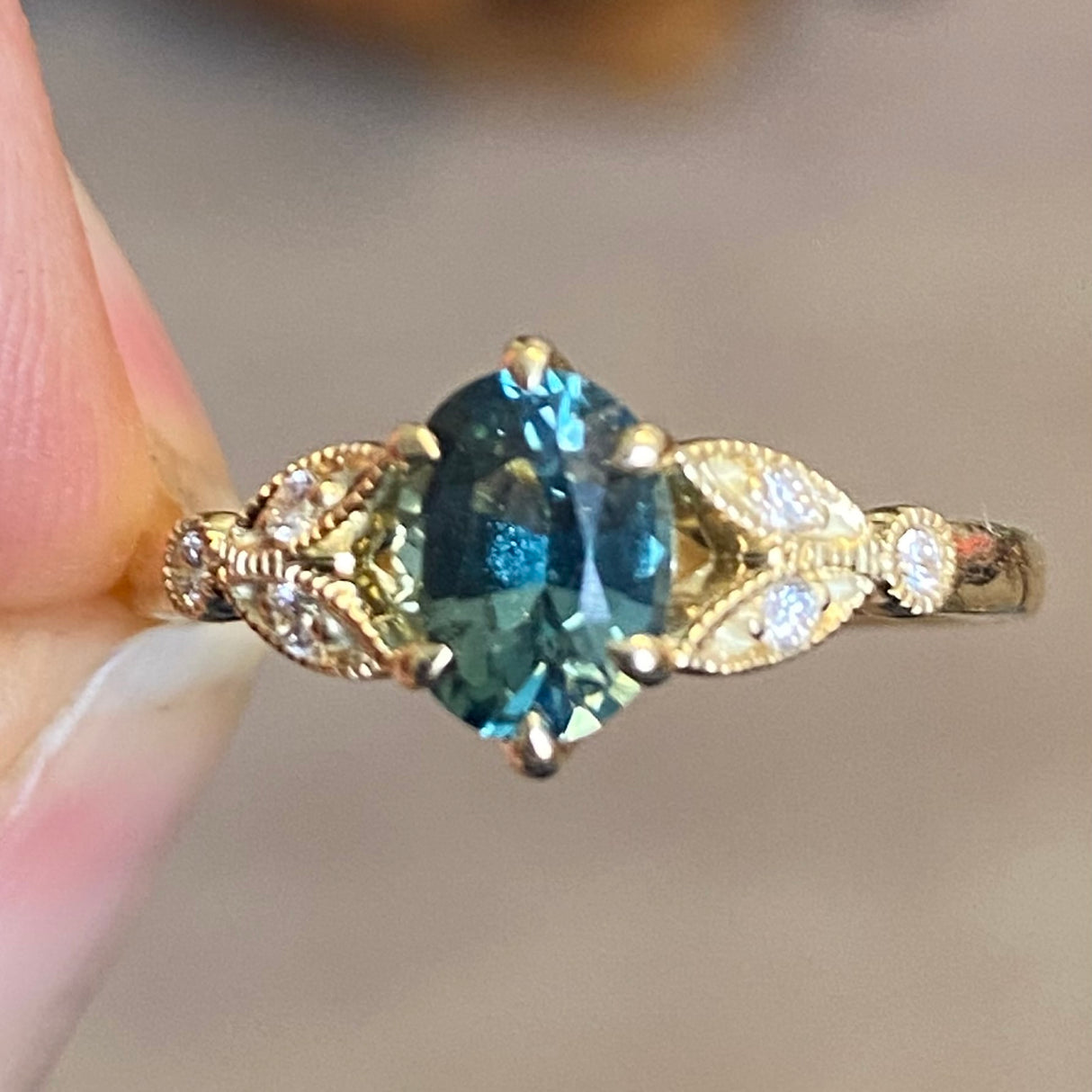 Antique inspired, fern-green sapphire & diamond engagement ring