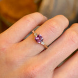 Pink sapphire and diamond three-stone engagement ring