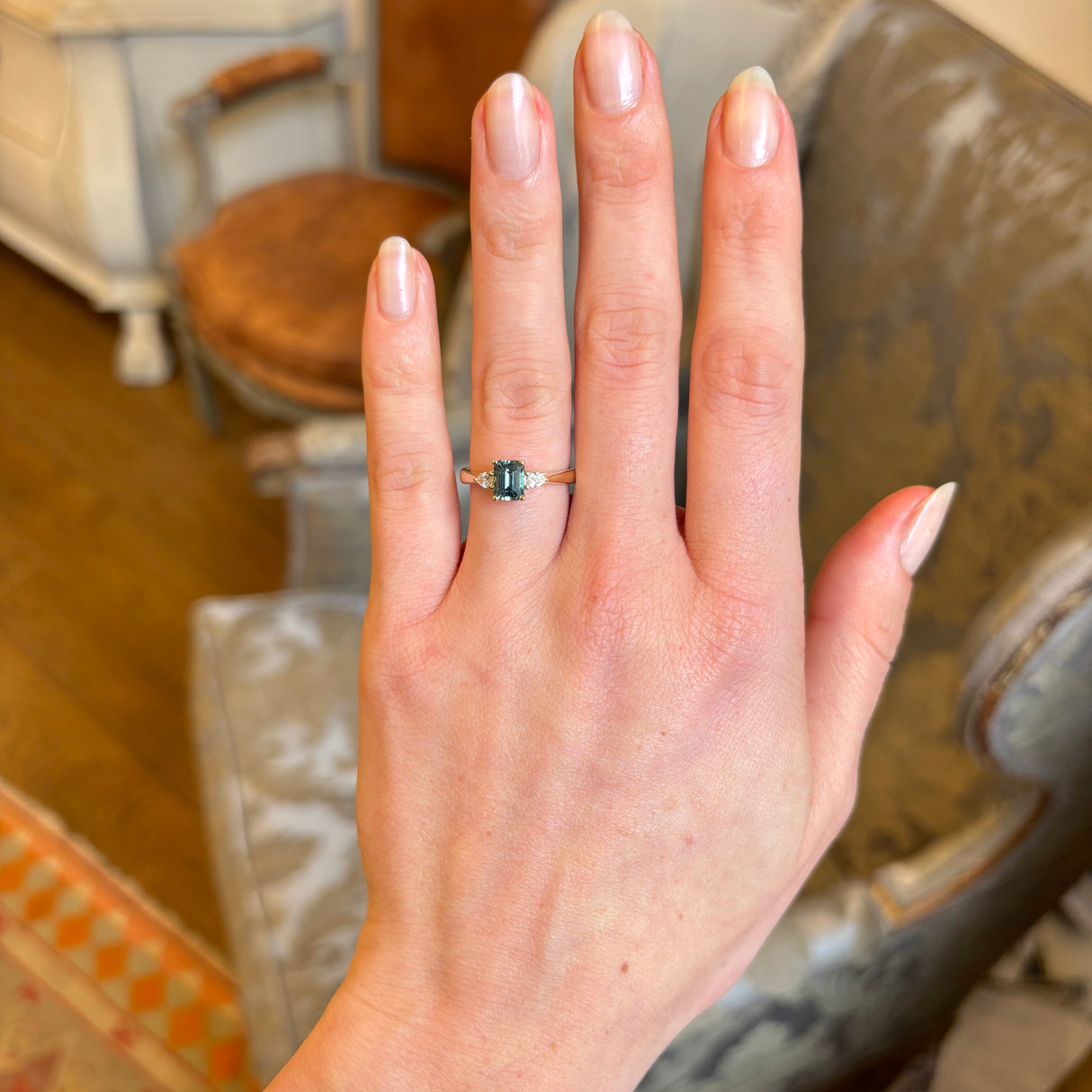 Green sapphire and diamond three-stone engagement ring