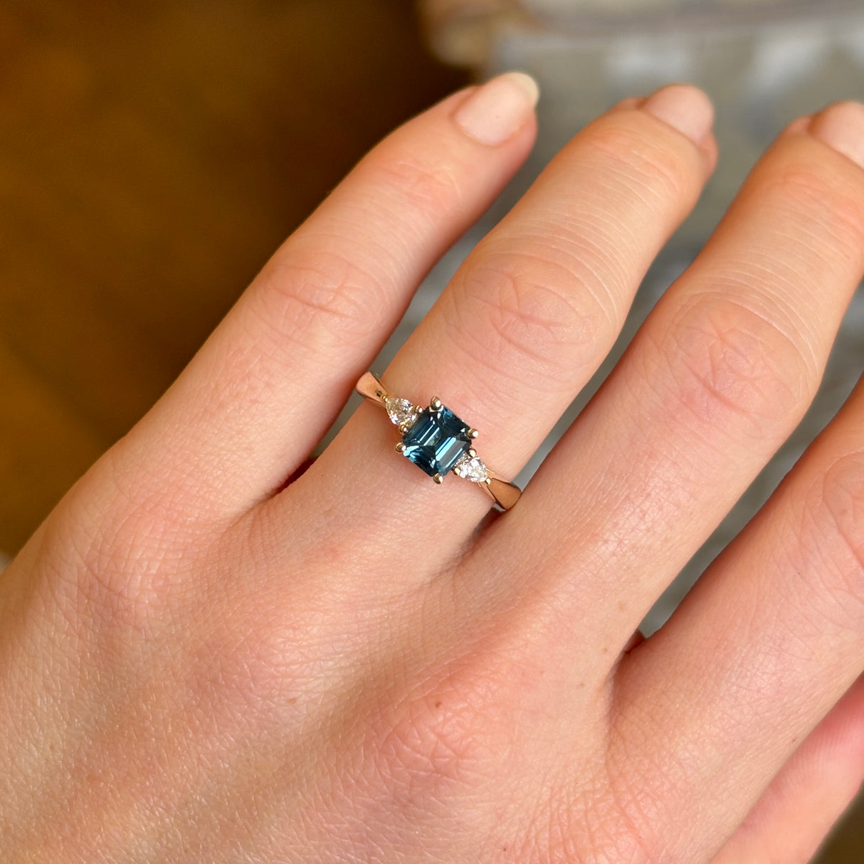 Teal sapphire and diamond three-stone engagement ring