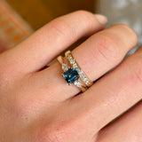 Teal sapphire and diamond three-stone engagement ring