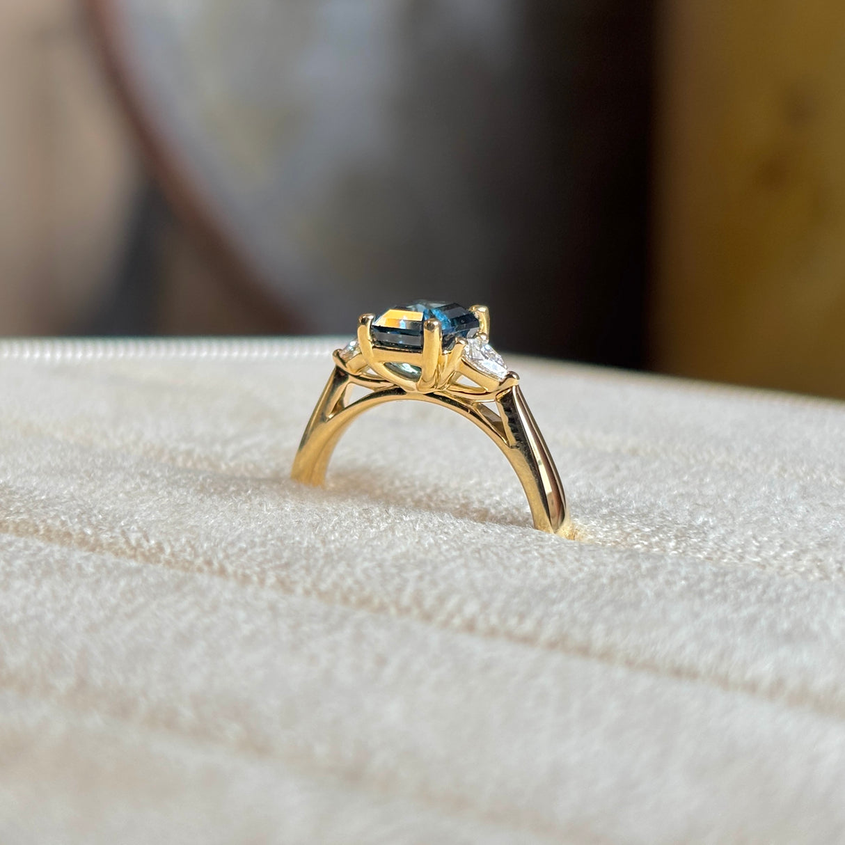 Teal sapphire and diamond three-stone engagement ring