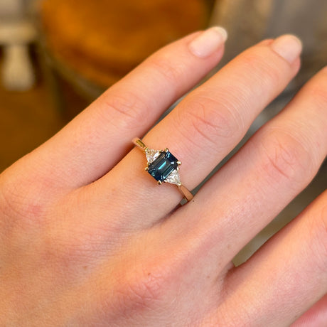 Teal sapphire and diamond three-stone engagement ring