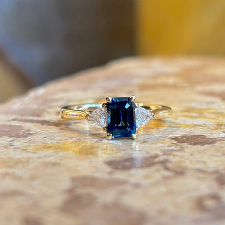 Teal sapphire and diamond three-stone engagement ring