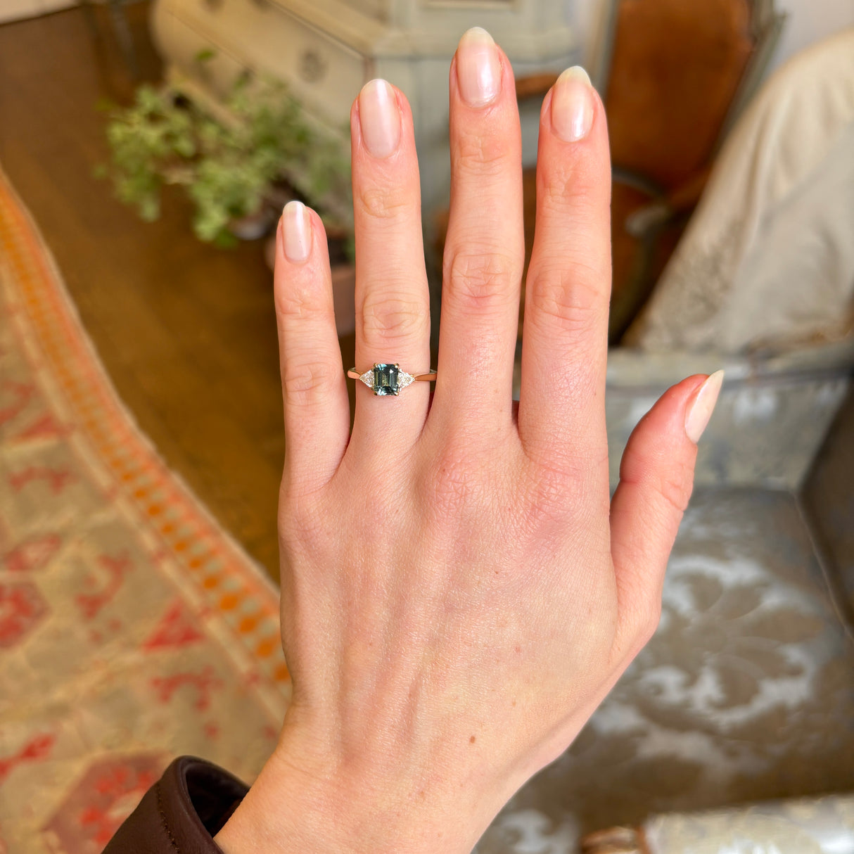 Green sapphire and diamond three-stone engagement ring