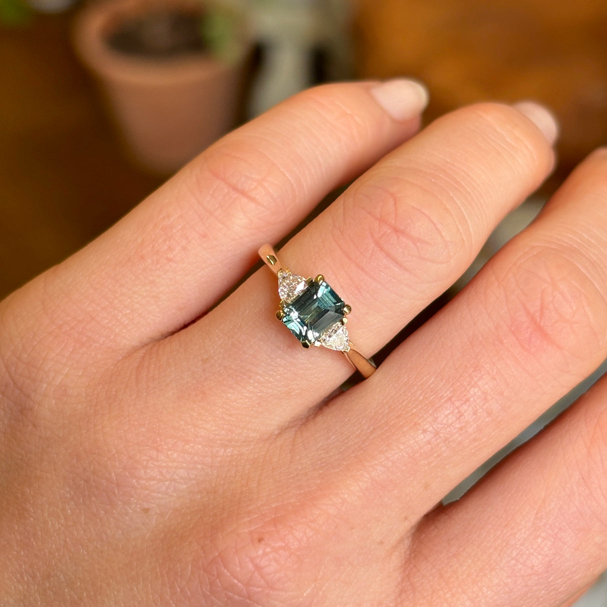 Green sapphire and diamond three-stone engagement ring