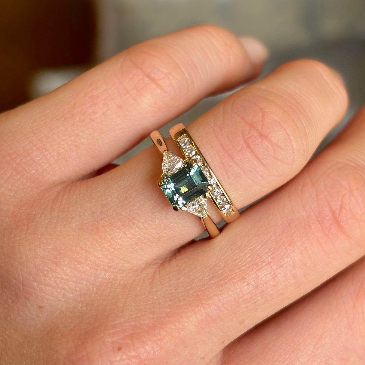 Green sapphire and diamond three-stone engagement ring