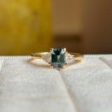 Green sapphire and diamond three-stone engagement ring